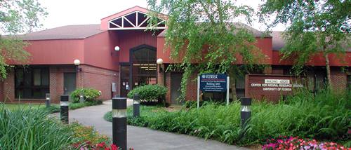 Modern campus building with accessible pathways and greenery at Pensacola State College.