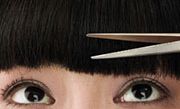Cosmetology Club students practicing eyelash extension techniques