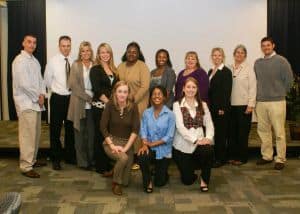 Diverse group of students and faculty celebrating academic excellence in technical education at Pens.