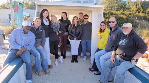 Group of diverse students from the Biology Club at Pensacola State College outdoors.