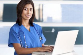 Nursing student working on a laptop for Practical Nursing Association activities.