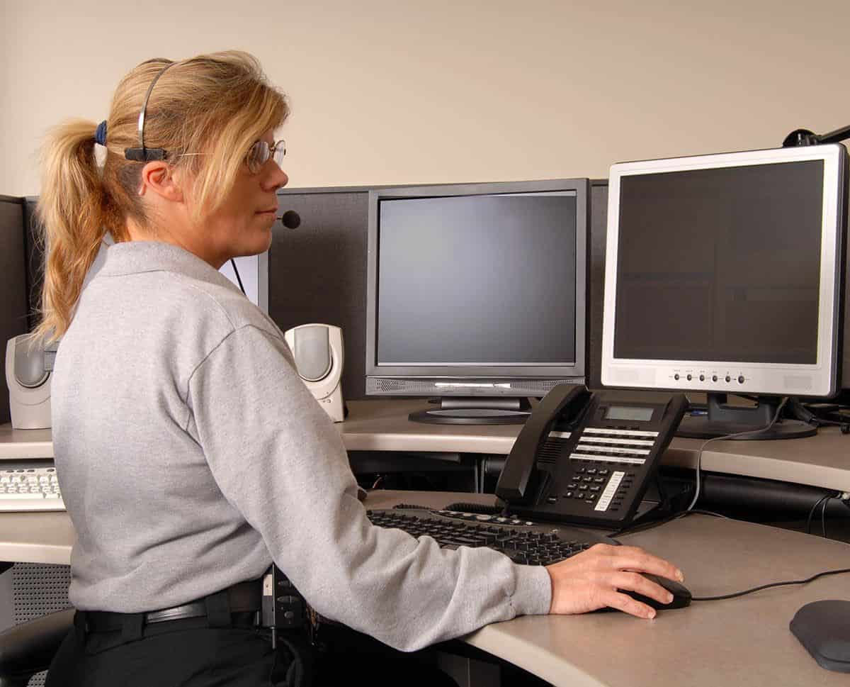 Business and management student working on computer in classroom setting.