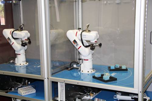Robotics arms used in advanced manufacturing training at Pensacola State College.
