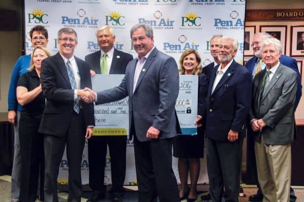 Pen Air presents $100,000 donation to support scholarships at Pensacola State College.