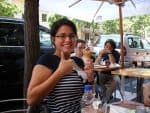Honors Program student smiling with ice cream outdoors at Pensacola State College.