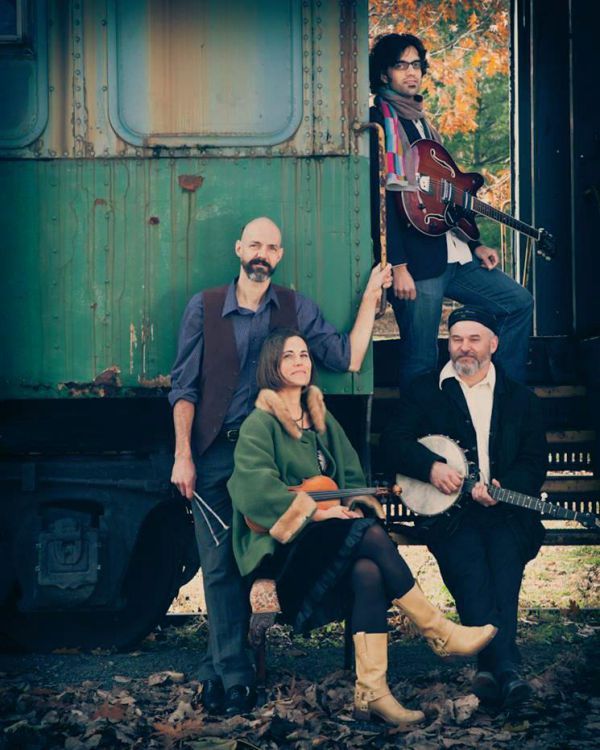 Live musical performance featuring Rani Arbo & Daisy Mayhem at Pensacola State College event.