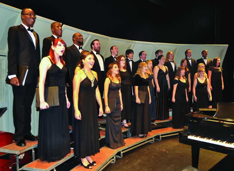 Choral and jazz students sing during a free college concert at Pensacola State College.