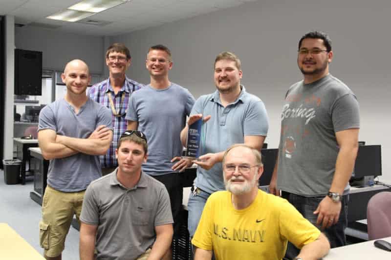 Cybersecurity team celebrating victory at ITEN summit, Pensacola State College.