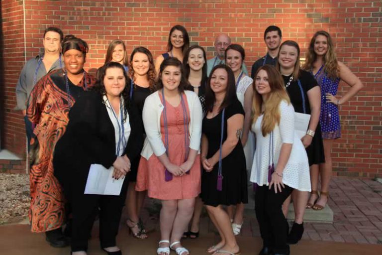 Group of Pensacola State students celebrating honor society induction.