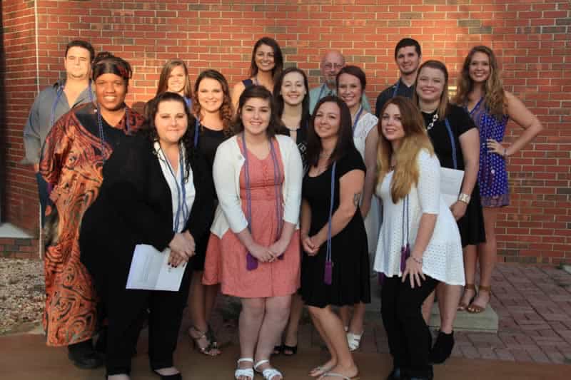 Group of Pensacola State students celebrating honor society induction.