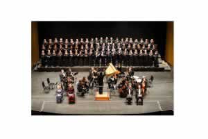 Choral Society of Pensacola performing Handel&rsquo;s &ldquo;Messiah&rdquo; at Saenger Theatre, showcasing a large cho.