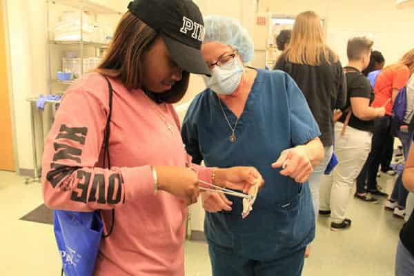High school students exploring health career opportunities at PSC event.