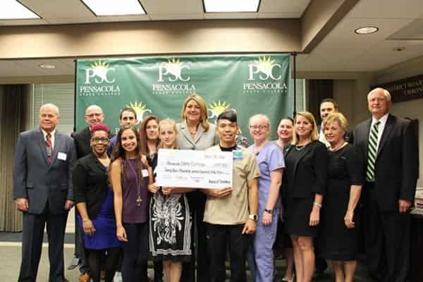First-generation allied health students receiving scholarships at Pensacola State College event.