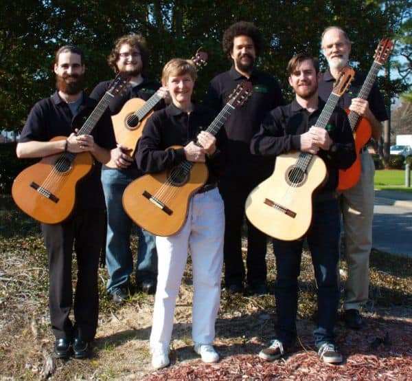 Guitar ensemble performing at Pensacola State College outdoor concert.