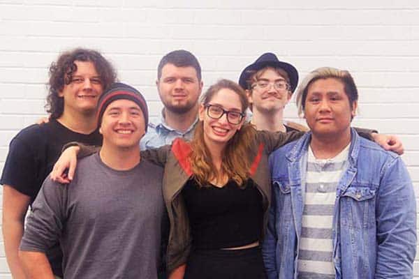 Diverse group of students enjoying campus life at Pensacola State College.