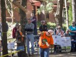 Lumberjack contest with students and community members participating outdoors.