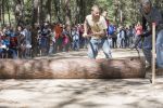 Lumberjack skills demonstration with students and spectators at Pensacola State College.