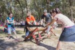 Lumberjack competition featuring students and instructors at Pensacola State College outdoor event.