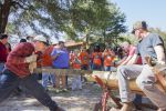Lumberjack event showcasing students and community participants demonstrating traditional woodcuttin.