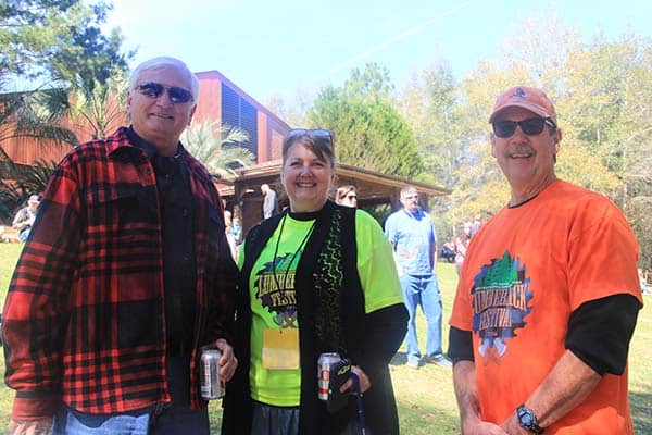 Lumberjack Festival outdoor event with smiling participants celebrating local traditions.