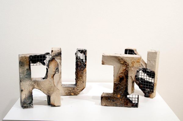 Modern mixed-media sculpture with metal mesh and concrete, part of the 51st Annual Art Students Hono.