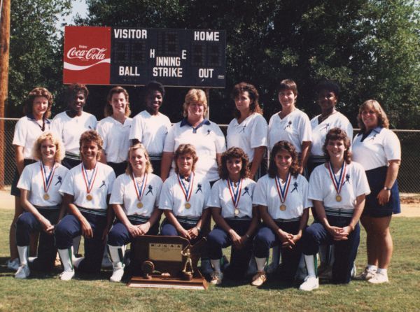 Pensacola State College softball team with coach posthumously inducted into FCSSA Hall of Fame.