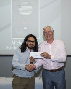 Scholarship presentation to a student by faculty member at Pensacola State College.