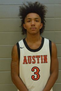 Young male basketball player with athletic build, wearing Austin jersey number 3, standing against a.