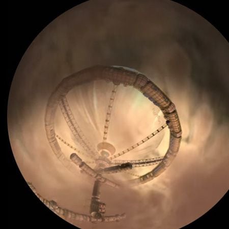 High-resolution image of a spiral space station orbiting a planet, emphasizing advanced space travel.