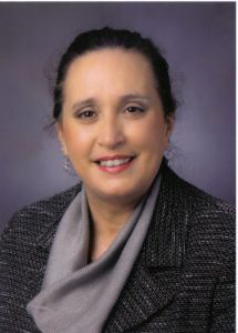Promoted faculty member at Pensacola State College recognized for leadership and academic achievemen.