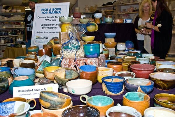 Colorful ceramic bowls for charity at Pick a Bowl 10th Anniversary event, supporting Manna food bank.