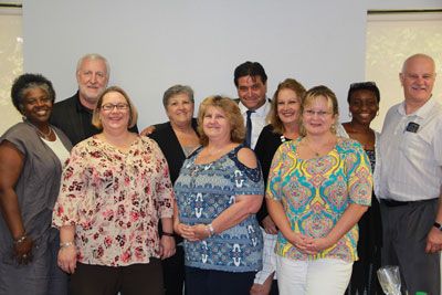 Pensacola State College leaders with AFC representatives during a visit.