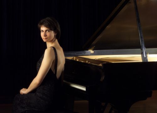 Young woman pianist Marina Lomazov performing on grand piano at PSC Kamerman Piano Series.