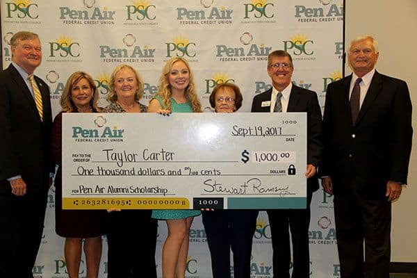 Celebrating the Pen Air Room Naming Ceremony with scholarship recipients and college officials.