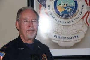 Promoted police officer at Pensacola State College public safety ceremony.