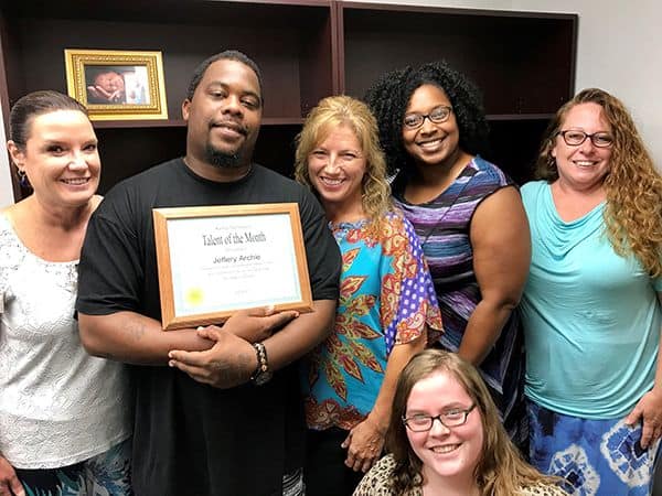 Student of the Month award presentation at Pensacola State College campus.