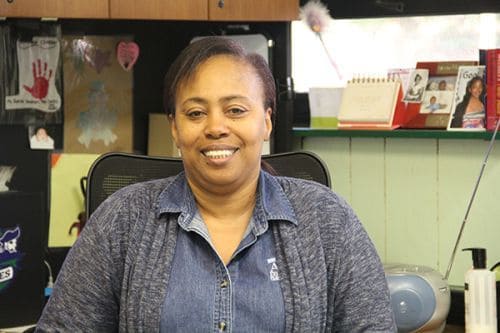 Student support staff member providing assistance at Pensacola State College.