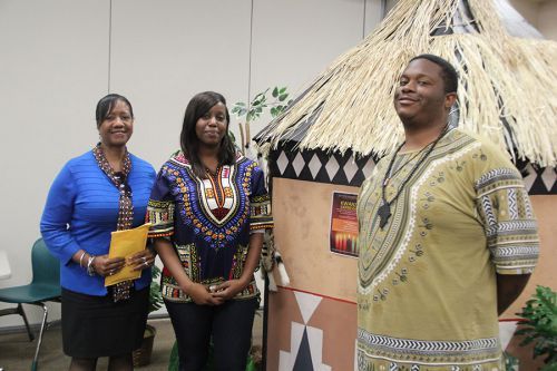 Diverse cultural representatives showcase traditional attire at Pensacola State College.