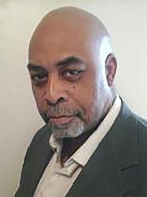 Prominent speaker at Pensacola State College event promoting diversity and cultural awareness.