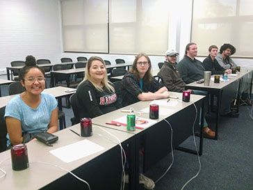 Students participating in a classroom session at Pensacola State College.