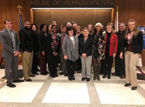 Group of diverse students and faculty at the Florida State Capitol during a leadership visit.