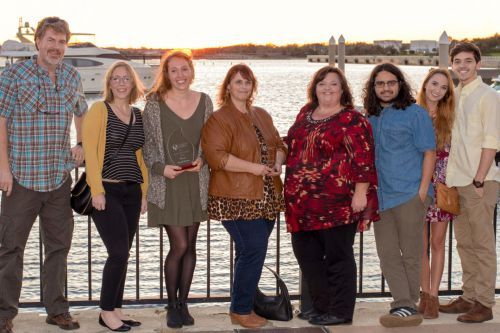 Diverse group of students and faculty enjoying sunset view at Pensacola State College.