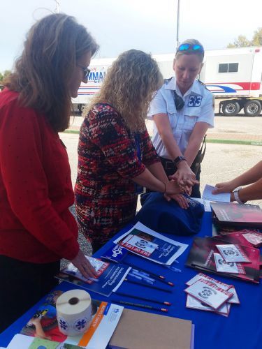 Emergency medical personnel demonstrate first aid techniques during Campus Safety Month 2018 event a.