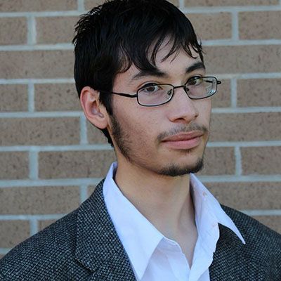Student receiving $1,000 grant from Florida Theatrical Association at Pensacola State College.