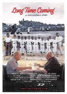 Historical baseball team photo from 1955, showcasing players and coaches at a community event.