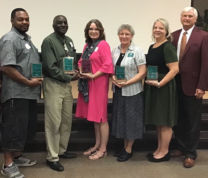 High-resolution image of Pensacola State College staff receiving 2018 Supervisor and Employees of th.