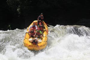 Outdoor education students experience river rafting on a whitewater course.