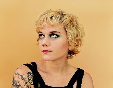 Portrait of Lydia Loveless, singer-songwriter, at Pensacola State College music event.
