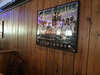 Lady Pirates basketball team poster at Pensacola State College.