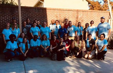 Community volunteers at Pensacola State College during United Way Day of Caring, engaging in service.
